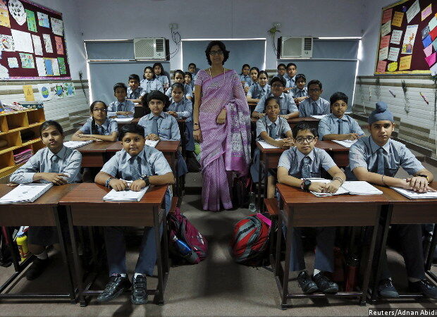 Students and teacher in classroom at S.S. Public School